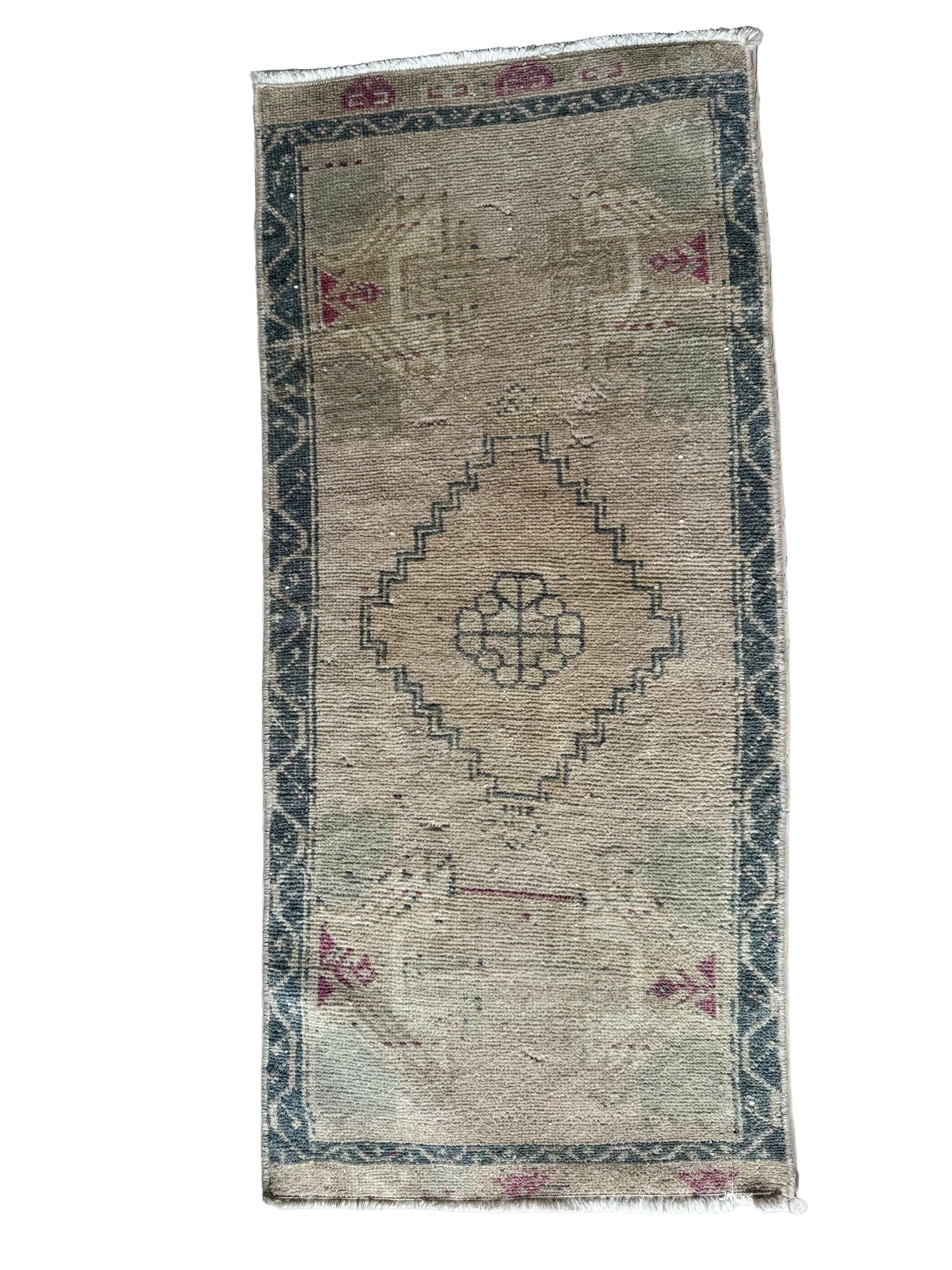 Mini vintage turkish neutral rug with blue and pink accents