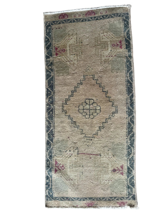 Mini vintage turkish neutral rug with blue and pink accents
